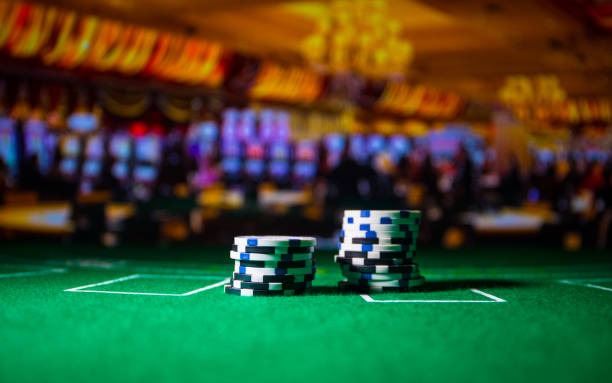 Live BandarQ dealer table with multiple player seats, card display, and betting areas visible on screen